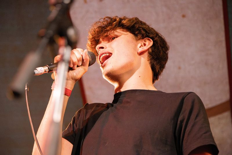 Singer performing into a microphone