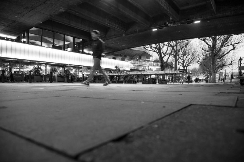 Spectator walking through a stadium concourse