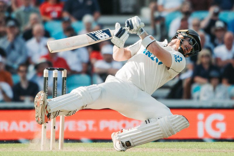 Cricket batsman diving to make his ground