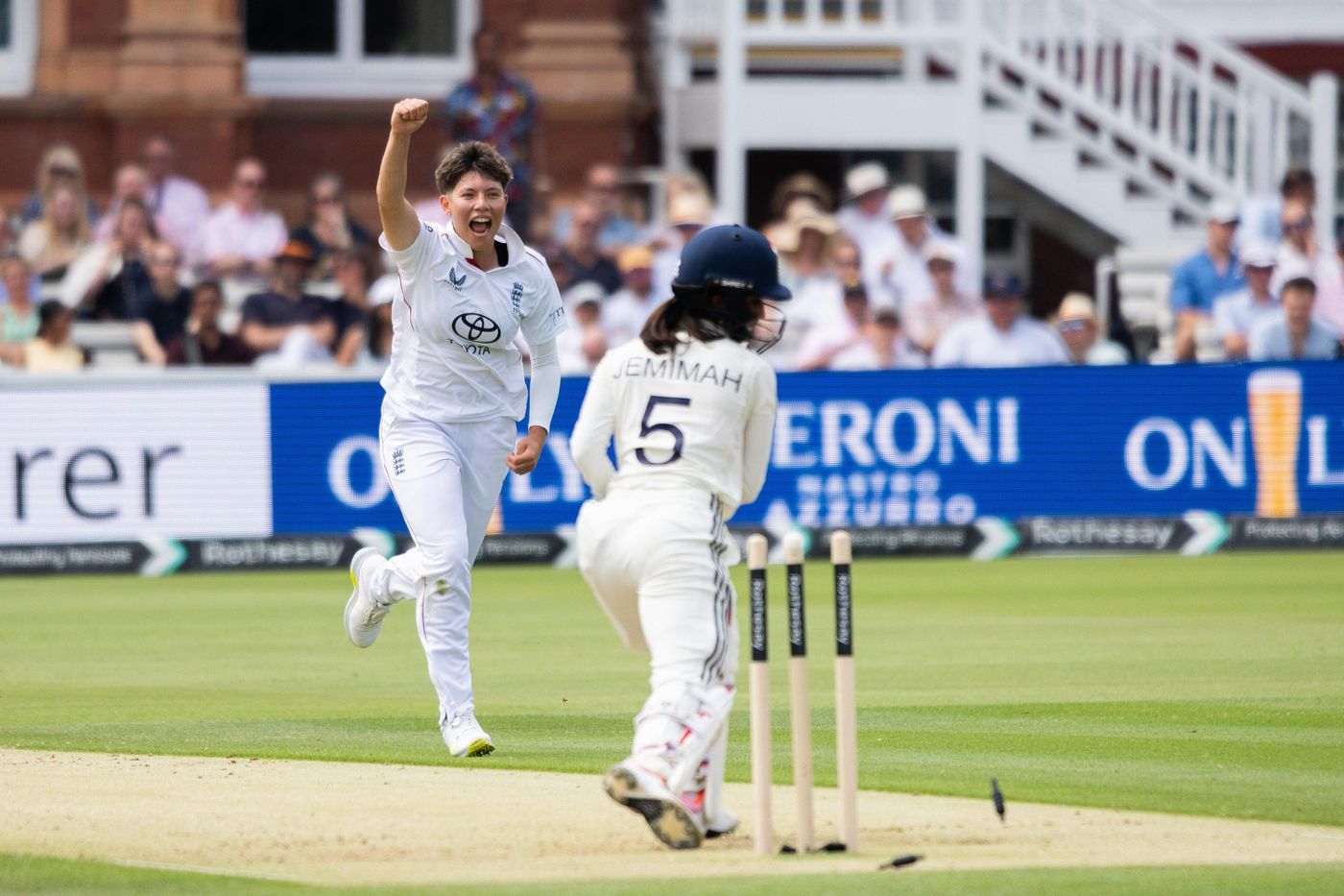 Cricket batsman defending at the stumps