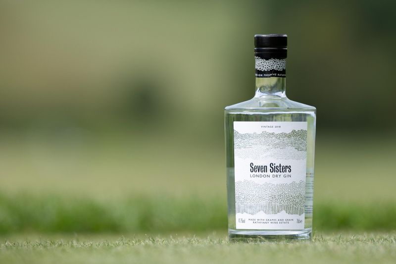 Bottle of gin on a wooden surface