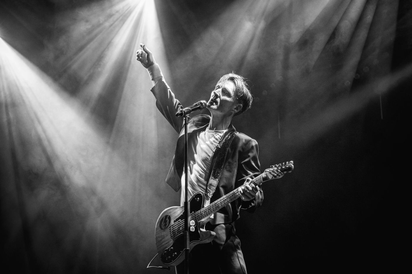 Guitarist on stage in black and white