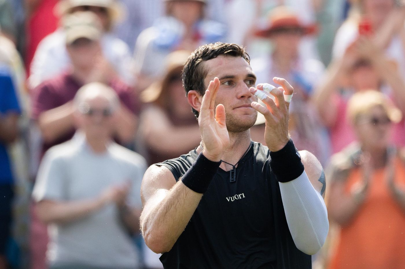 Tennis player celebrating a win with the crowd
