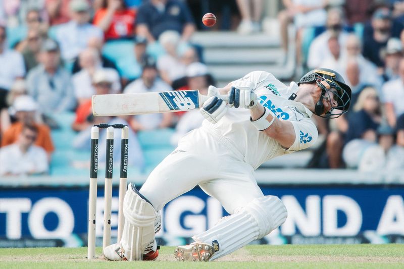 Test cricketer playing a shot in whites